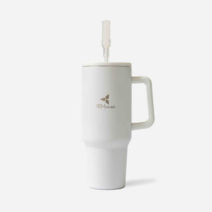 White tumbler with handle and straw on a light gray background